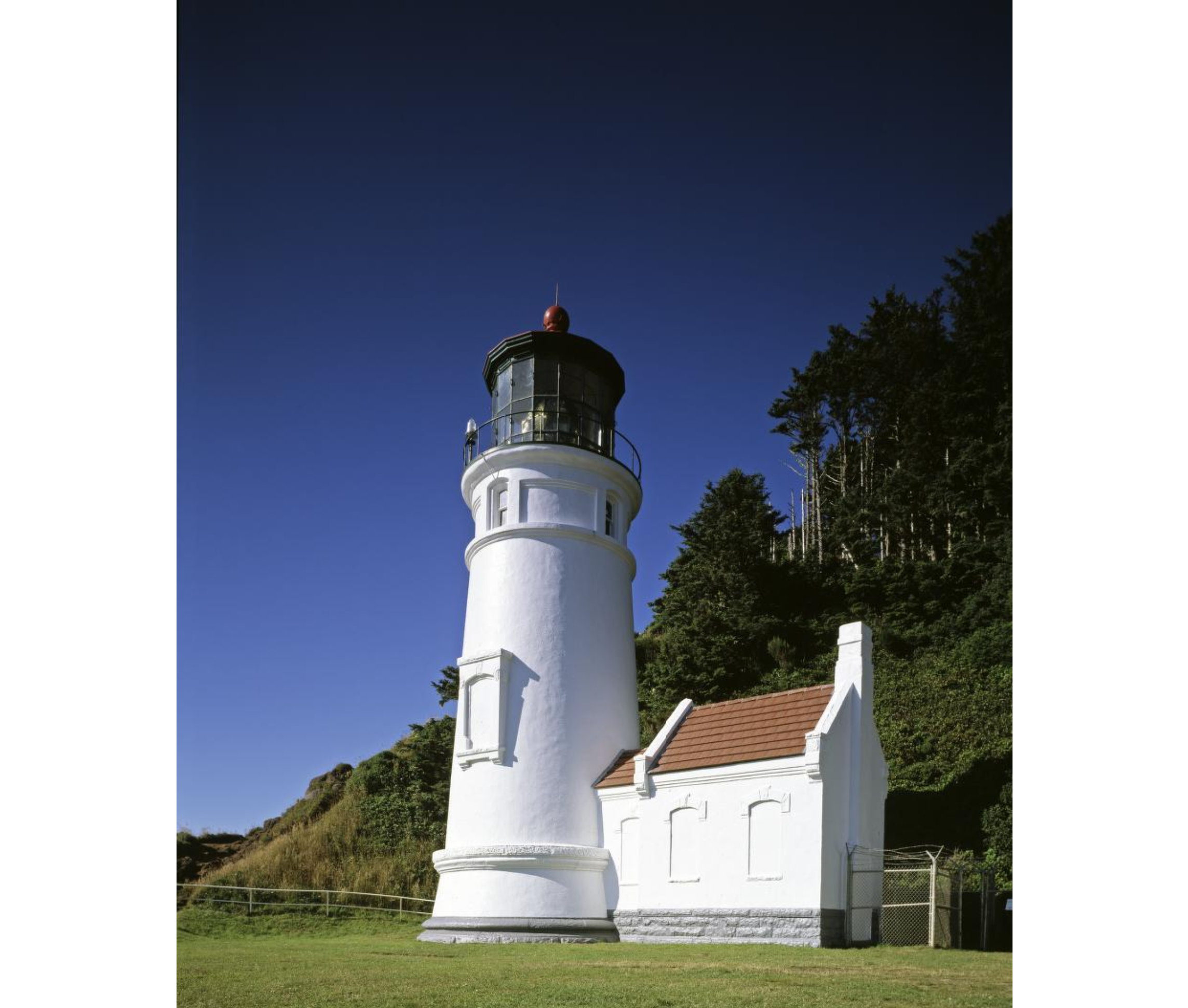 The historic lighthouse standing on the eastern shore